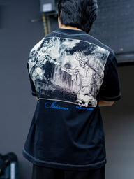Back of the Gatekeeper Premium oversized tee in black with battle artwork print, worn by model