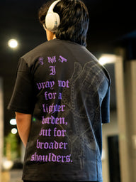 Close-up of the purple scripture back print on the Strength and Power Premium oversized tee