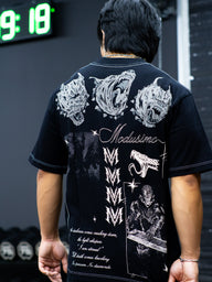 Close-up of the Sacrifice demon mask back print on the black Premium oversized tee, worn