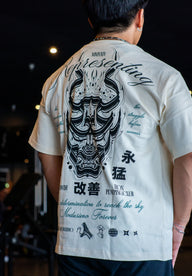 Close-up of the Kenshin oni mask and kanji back print on the pastel cream Premium tee