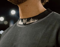 Collar detail with neck logo on the Ashes to Ashes Premium oversized tee in black