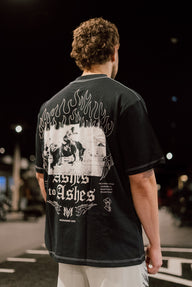 Close-up of the Ashes to Ashes horseman back print on the black Premium oversized tee, worn