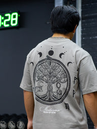 Close-up of the Chase the Night tree of life and moon phase back print on the snakestone tee