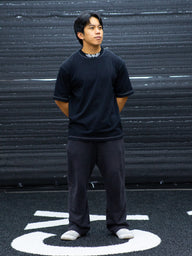 Model wearing the Ragnarok Premium oversized tee in black, front view