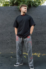 Model wearing the SSSTYLISH! comfort sweatpants in deadwood gray with a black oversized tee