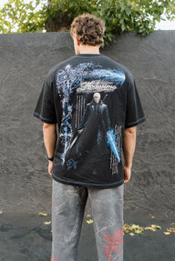 Model from behind wearing the Motivated Premium oversized tee in black with blue swordsman back print