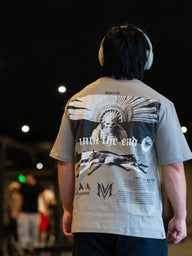 Close-up of the Death Whistle back print on the snakestone Premium oversized tee, worn